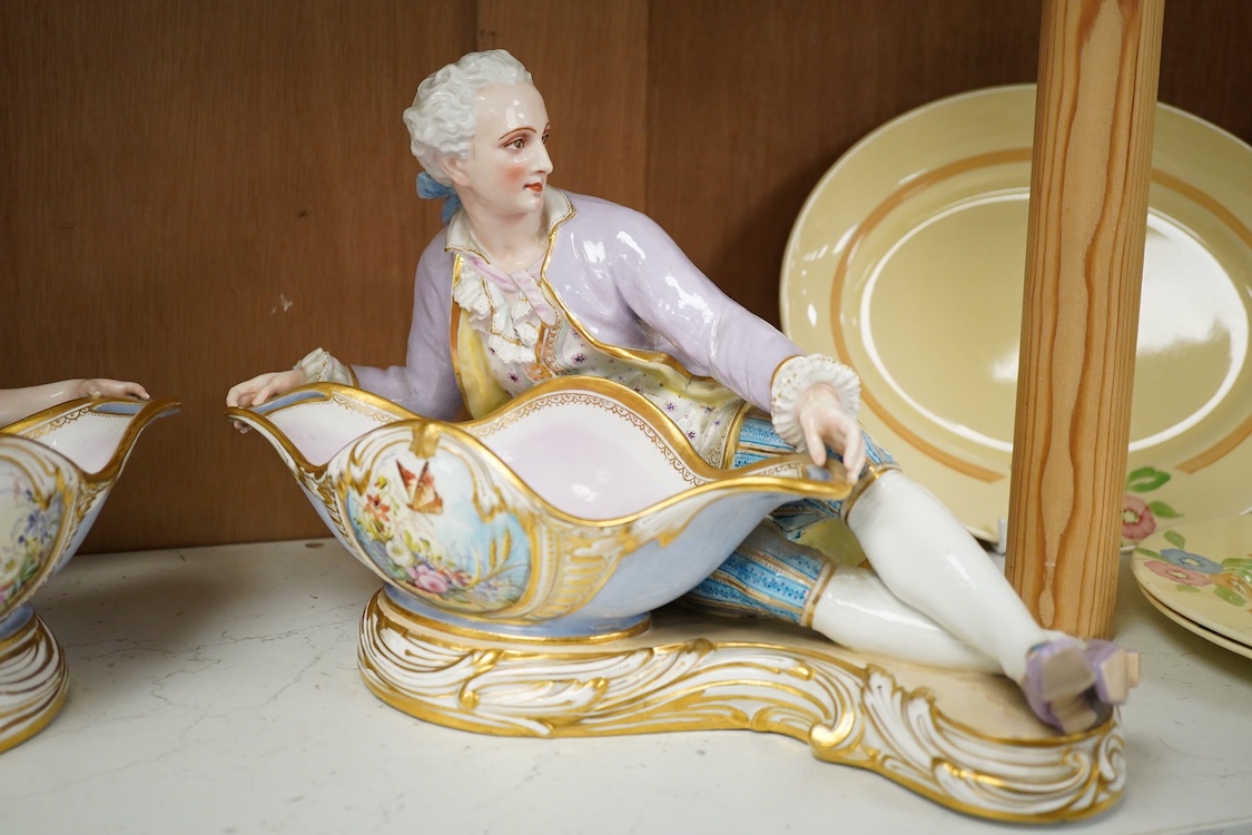 A pair of French porcelain figural sweet meat dishes, late 19th century, 34.5cm